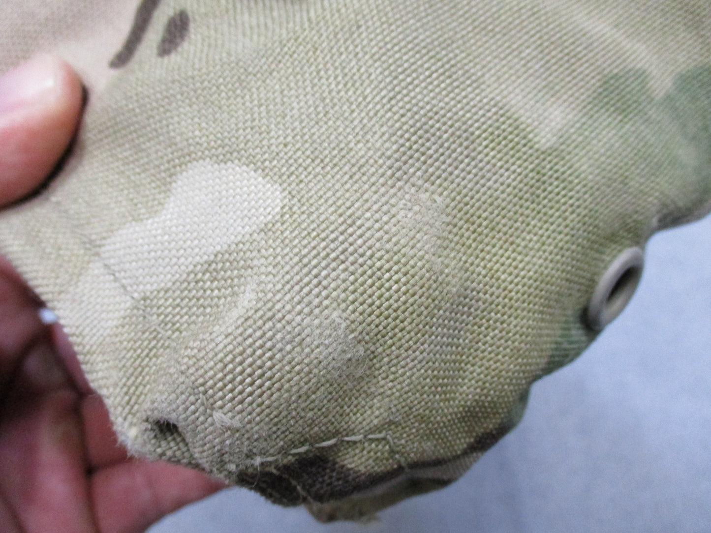 USGI Multicam IFAK pouch with expired medical supplies, military-style first aid kit by Centex Military Gear, open with contents visible.
