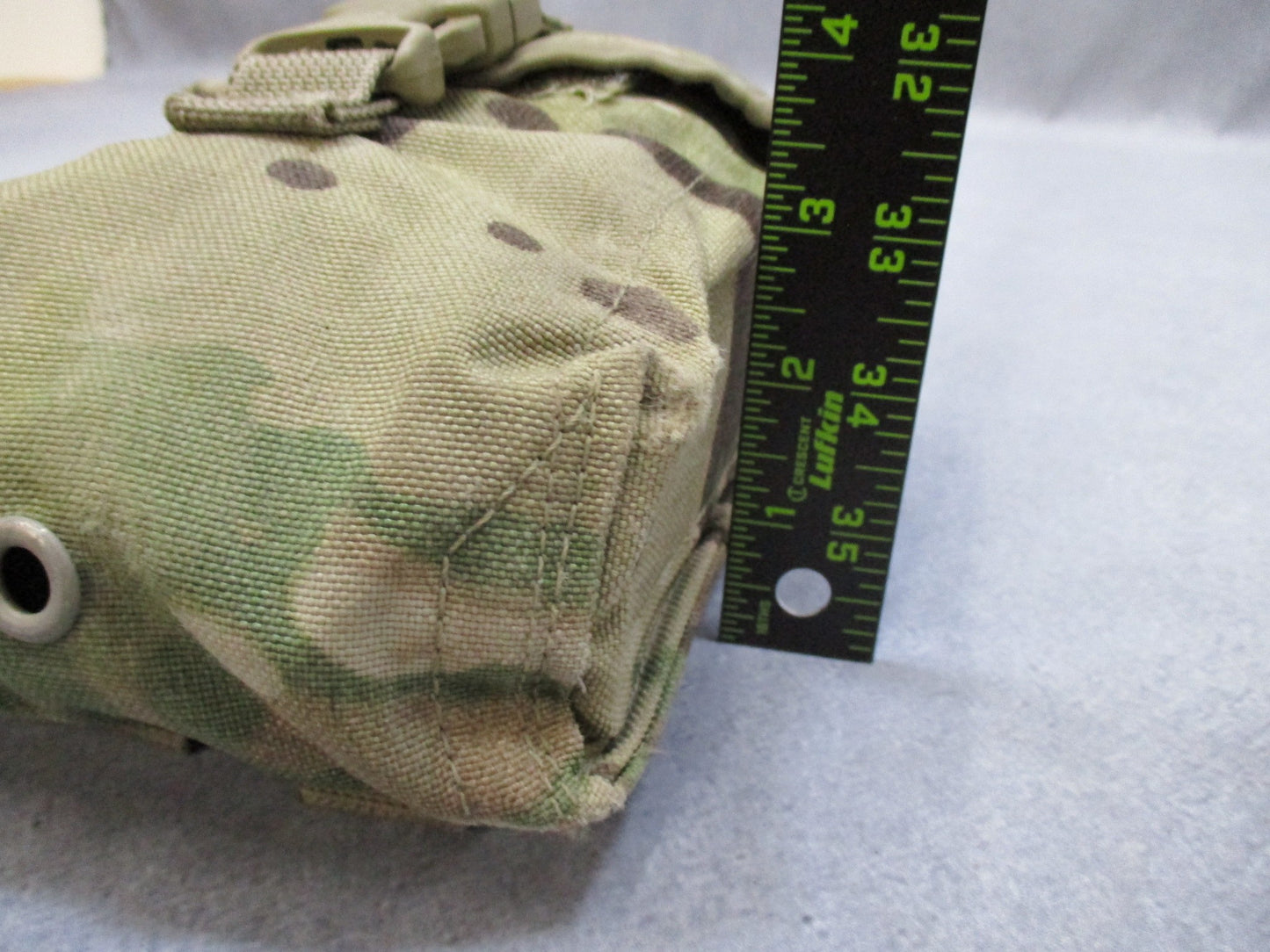 USGI Multicam IFAK pouch with expired medical supplies, military first aid kit by Centex Military Gear, shown with open pouch.