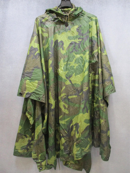 USGI military rain poncho in woodland camouflage, ripstop fabric, durable design, used for outdoor weather protection by Centex Military Gear