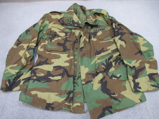 USGI M65 Field Jacket in woodland camouflage by Centex Military Gear, large regular size, with patches for cold weather wear.