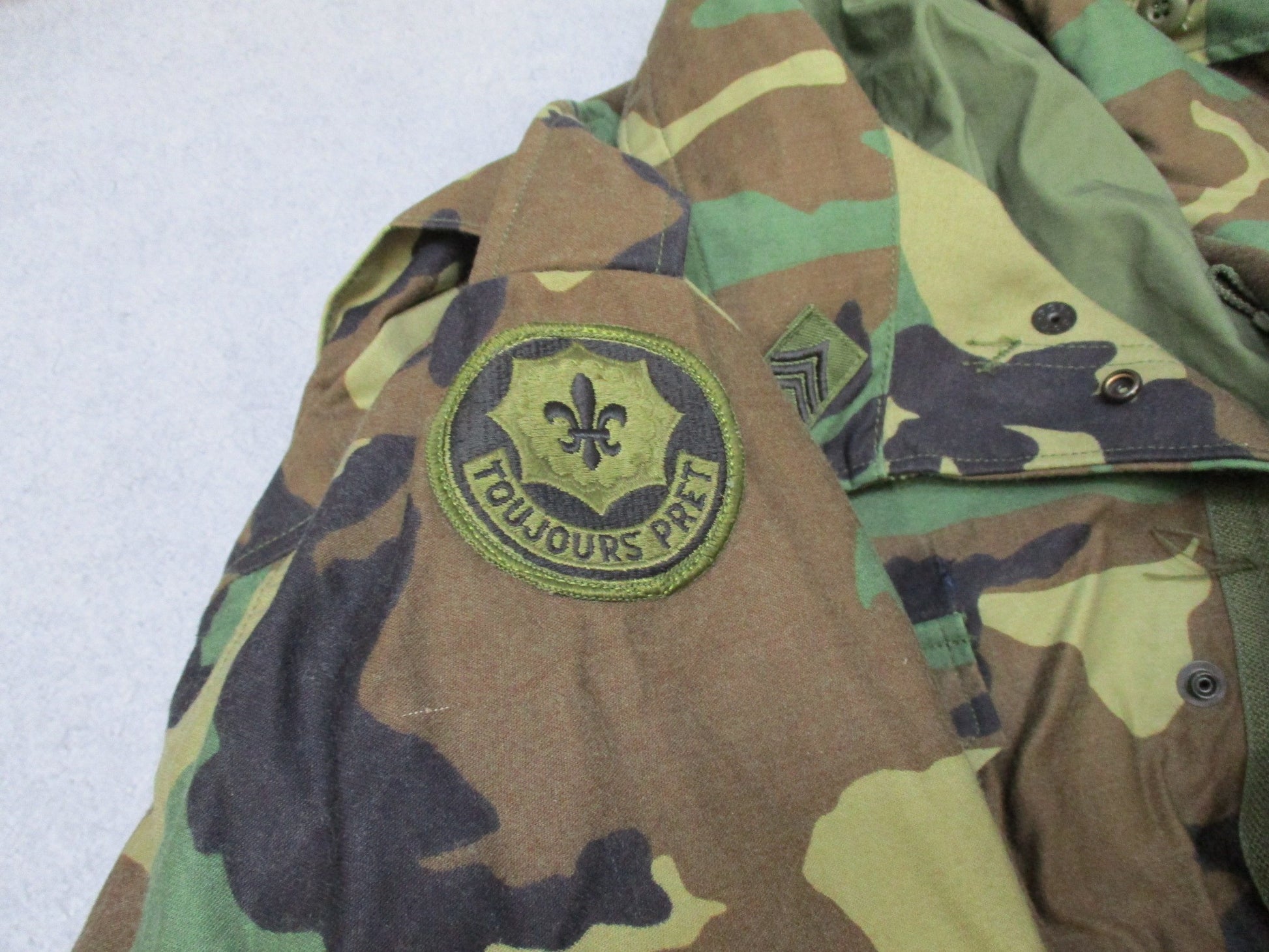 USGI M65 Field Jacket Woodland in Large Regular size with patches, a cold weather military coat by Centex Military Gear.