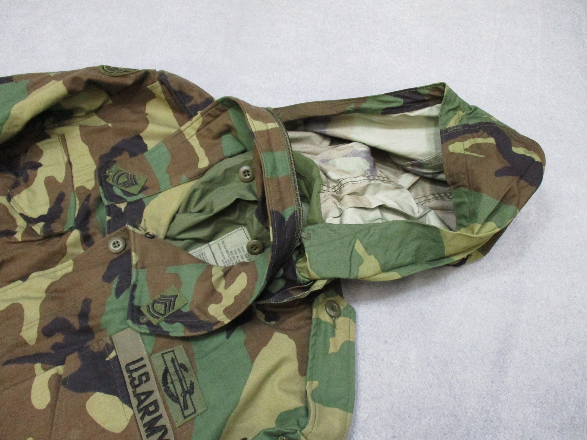 USGI M65 Field Jacket Woodland in large regular size, featuring patches, designed for cold weather military-style wear by Centex Military Gear.