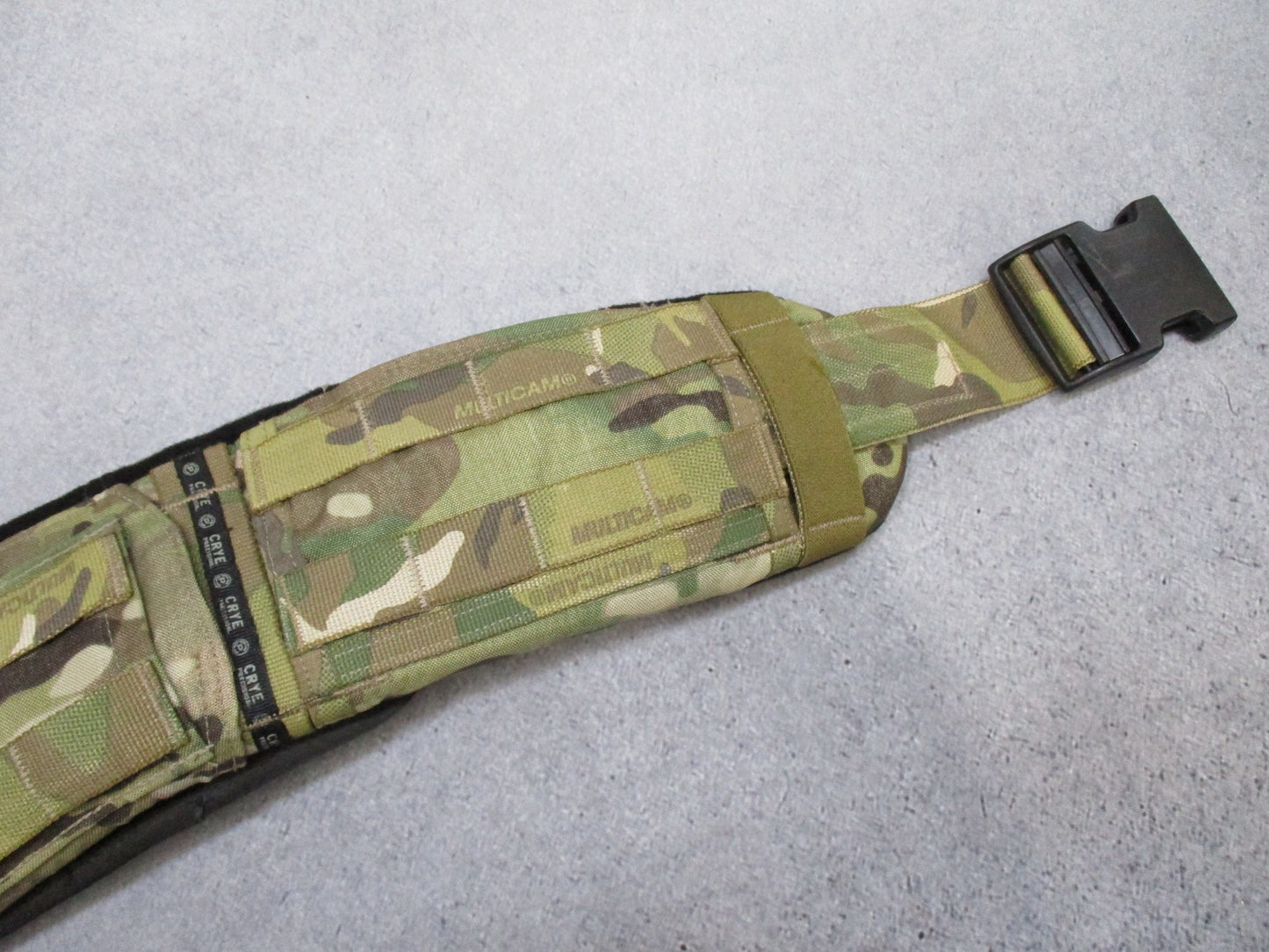 Crye Precision Multicam padded tactical battle belt with MOLLE system, small size, featuring adjustable straps and reinforced padding.