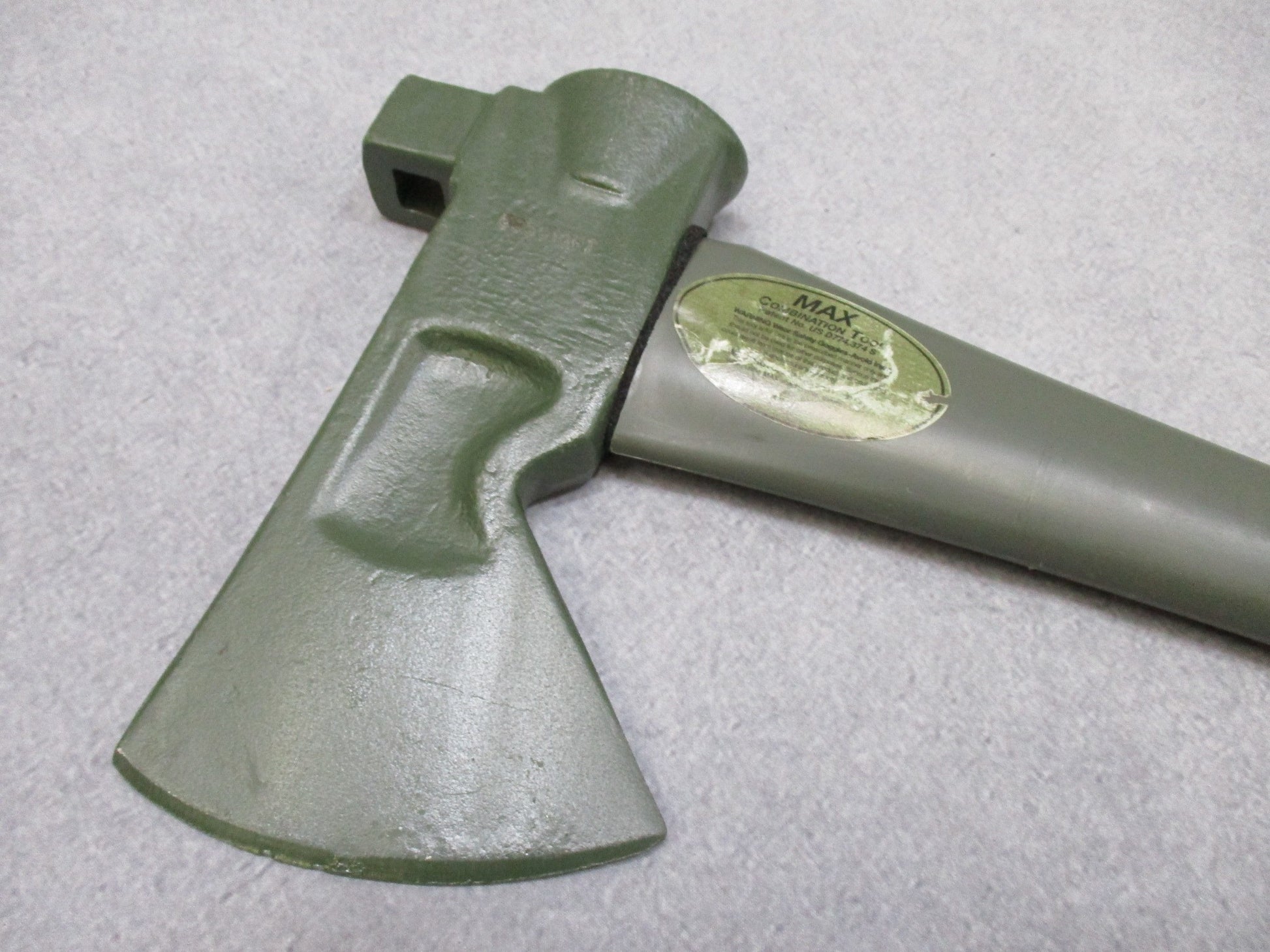 USGI Forest Tool MAX axe with OD green fiberglass handle, 34.5 inches, designed for outdoor and military use by Centex Military Gear