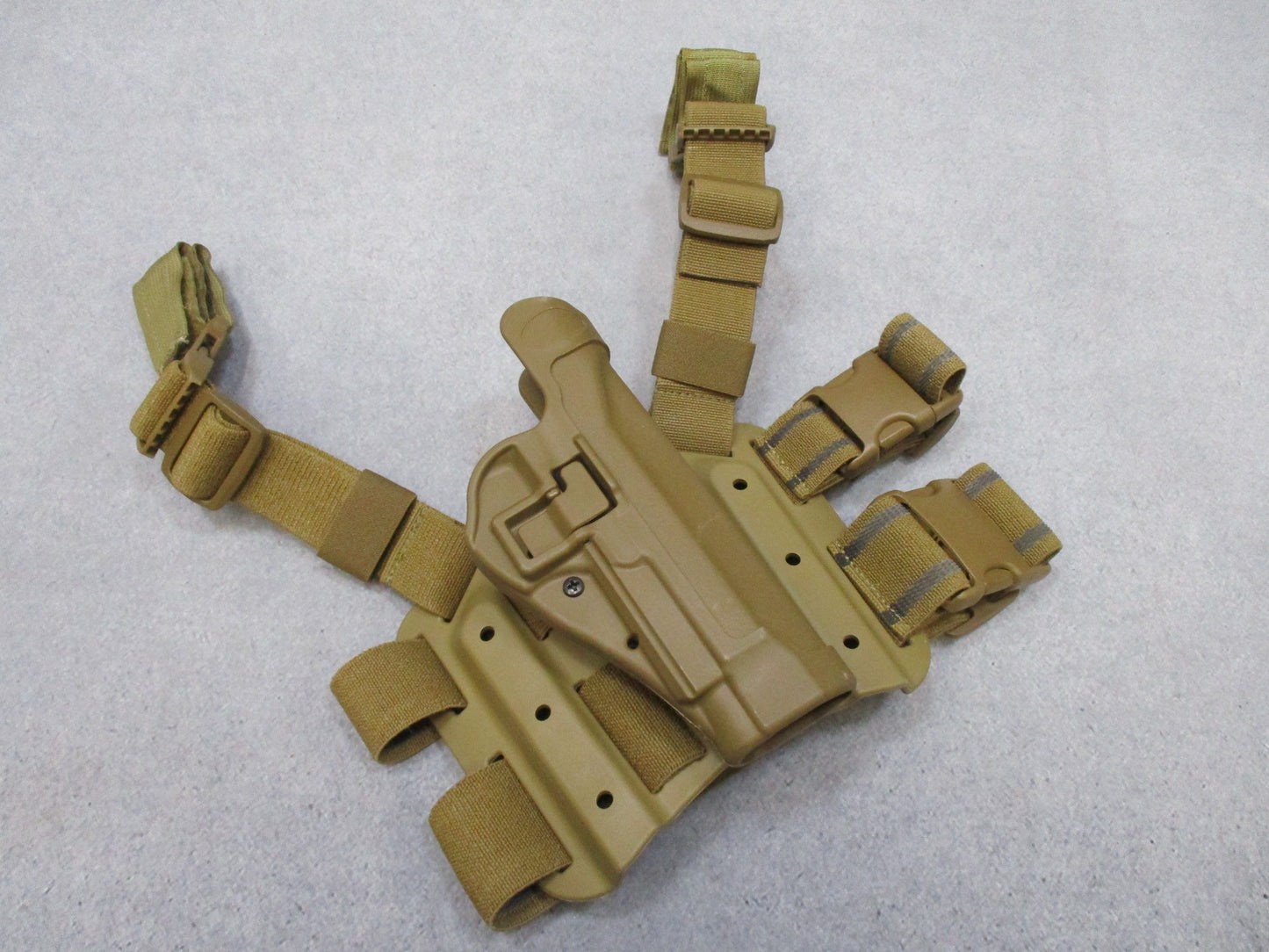 BlackHAWK SERPA CQC thigh holster for Beretta 92/96, tactical Coyote Tan, designed for right-handed use, by Centex Military Gear.