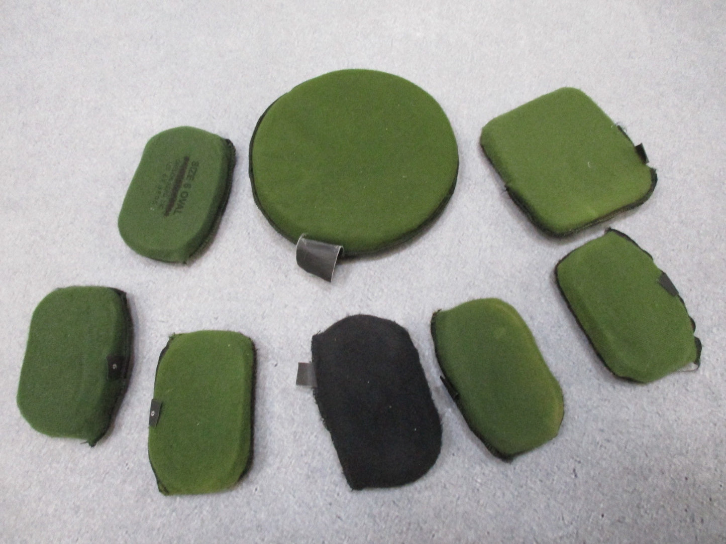 MSA ACH helmet in foliage green with Team Wendy chinstrap and Oregon Aero pads, shown from the side.