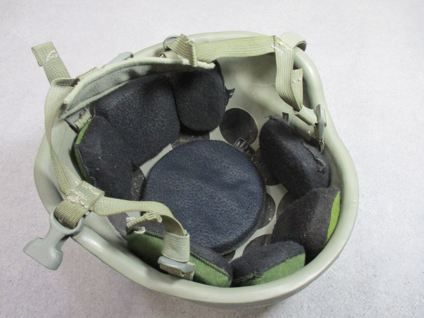 MSA ACH helmet in foliage green with Team Wendy chinstrap and Oregon Aero padding, designed for military and tactical use.