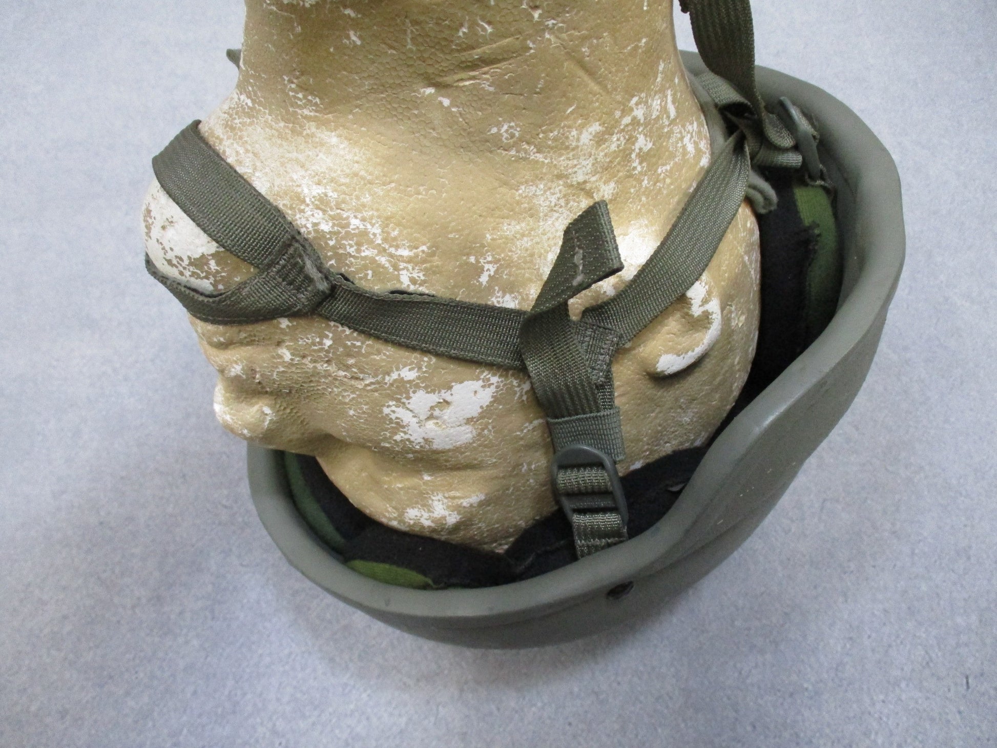MSA ACH helmet in foliage green with Team Wendy chinstrap and Oregon Aero pads for military protective gear.