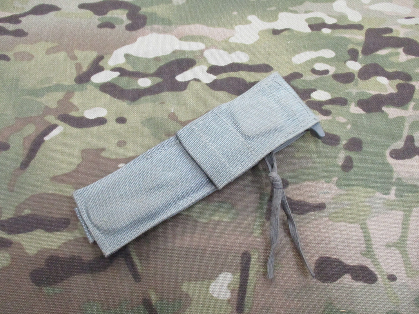 Used Ontario Knife strap/seat belt cutter with sheath, foliage parachute knife by Centex Military Gear, showing the cutting blade and handle
