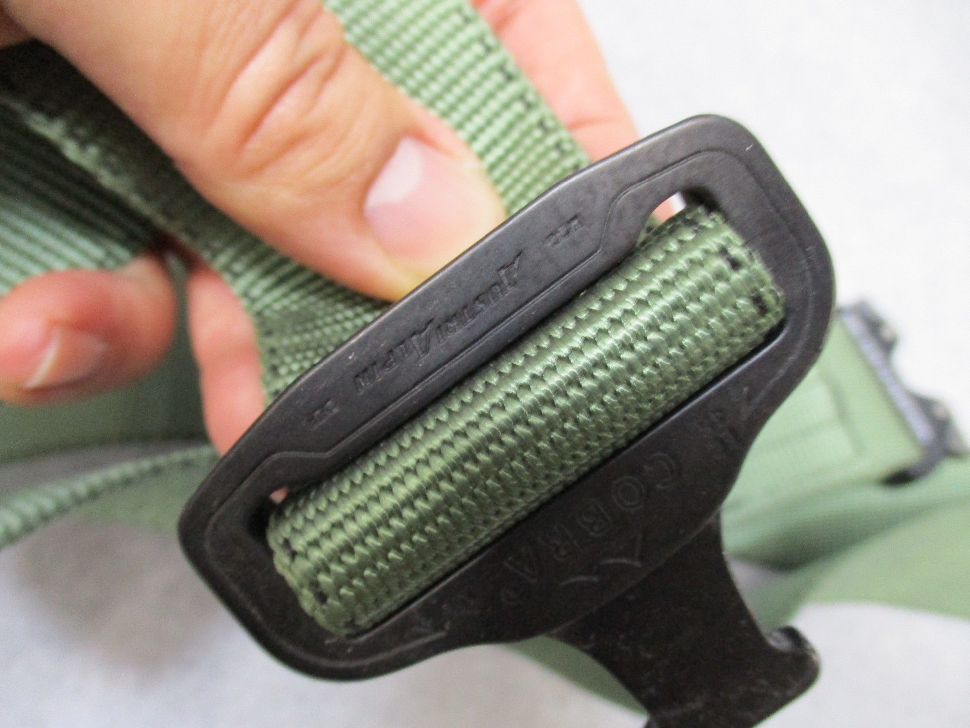 Heavy-duty US military stretcher strap with Cobra buckle for patient securing and transport, by Centex Military Gear.