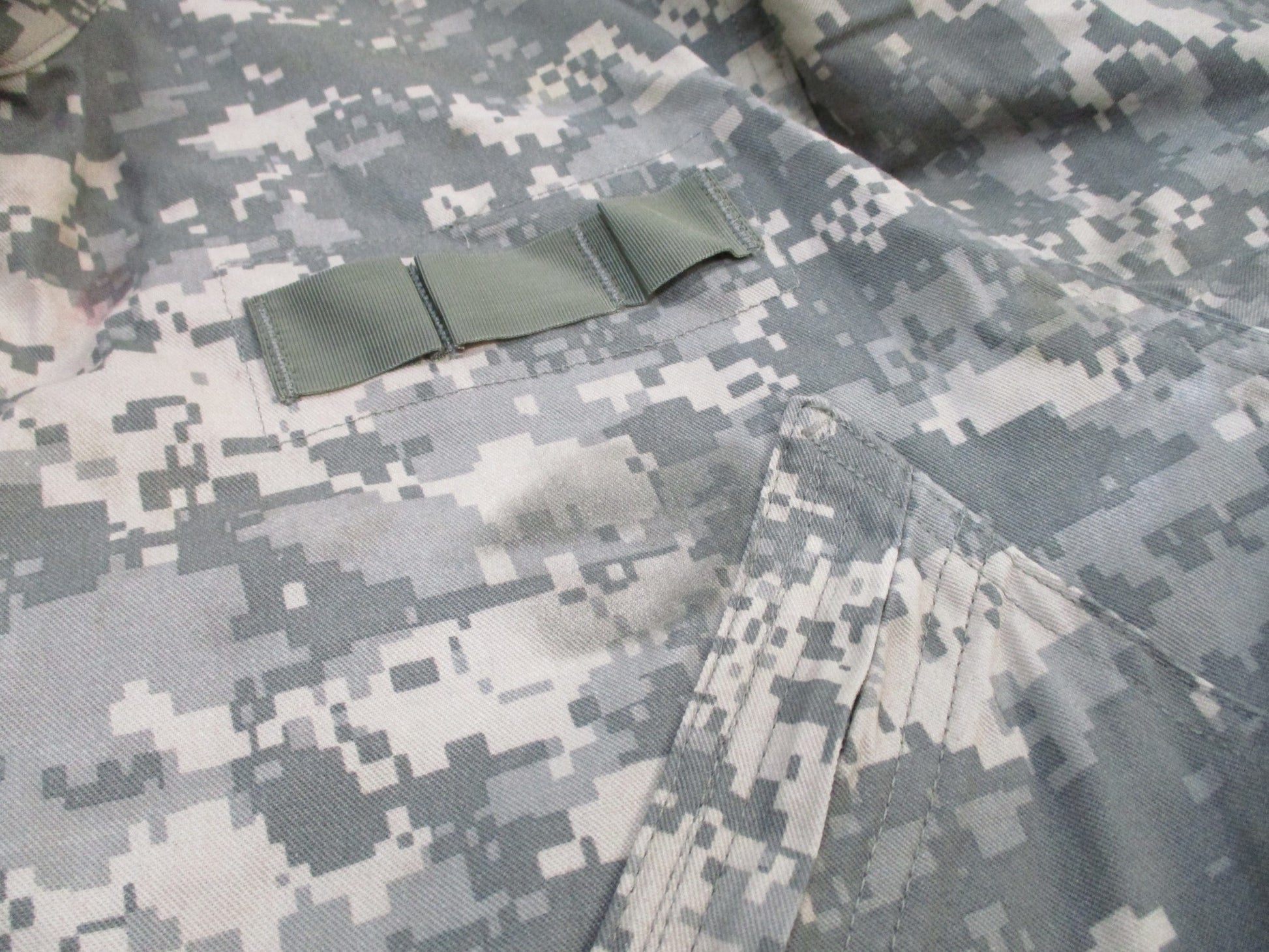 Used Centex Military Gear mechanic coveralls in UCP digital camo, size large, Type III army issue work suit with multiple pockets.