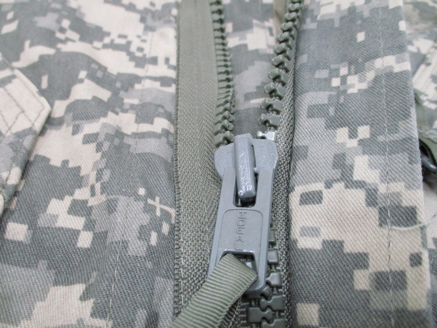 Used Centex Military Gear UCP Type III Army mechanic coveralls in large size, digital camouflage, front pockets, and durable fabric.