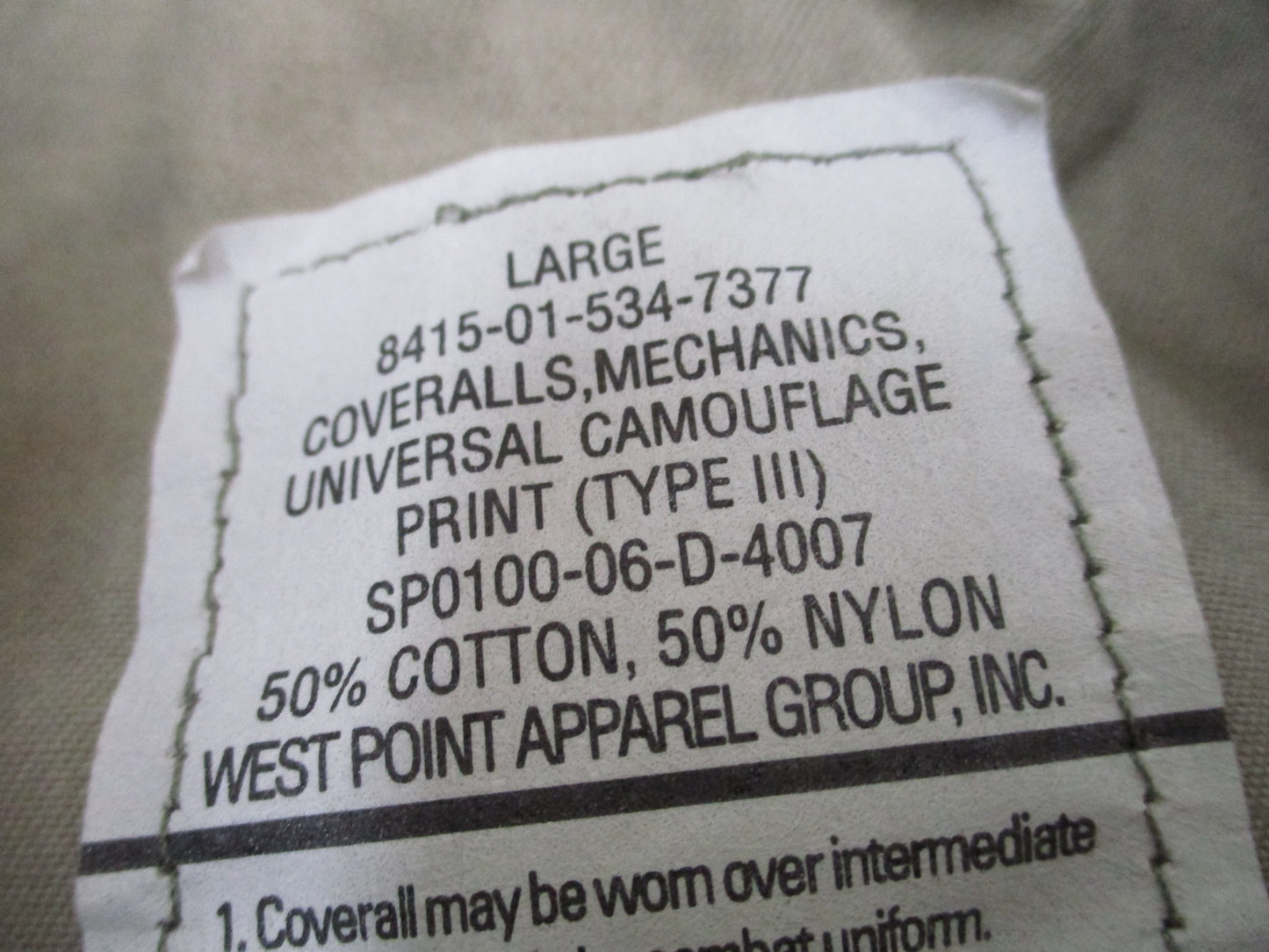 Used Centex Military Gear UCP Army mechanic coveralls, Type III large ACU digital camouflage, front view with pockets and zipper