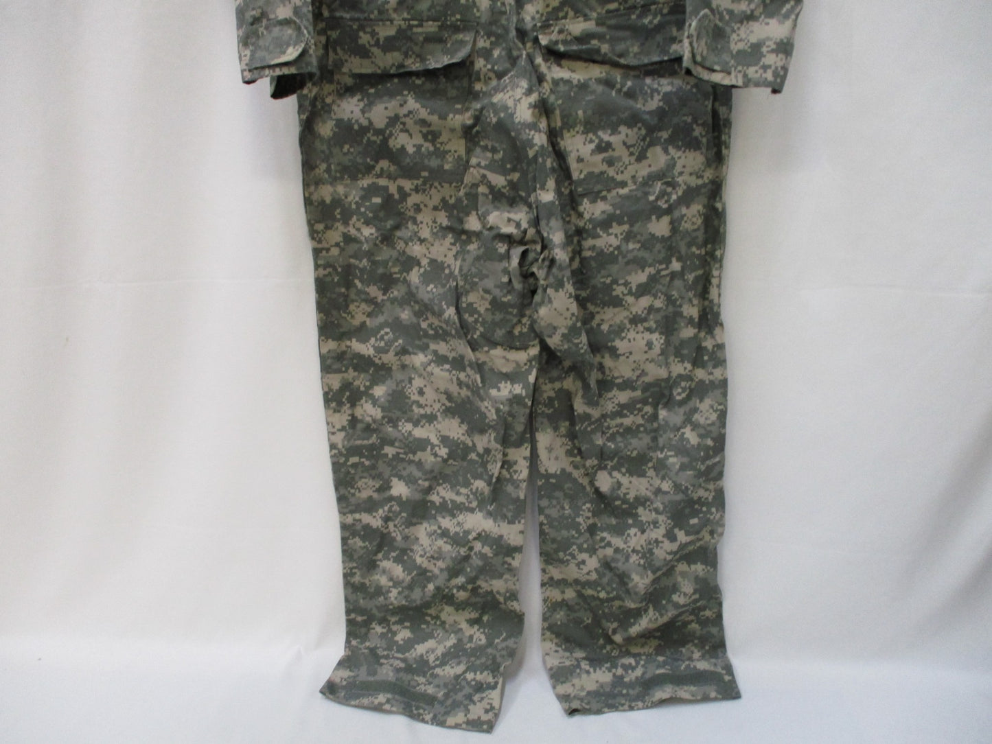 Used Centex Military Gear UCP Army mechanic coveralls, Type III, large ACU digital pattern, with multiple pockets and reinforced knees.