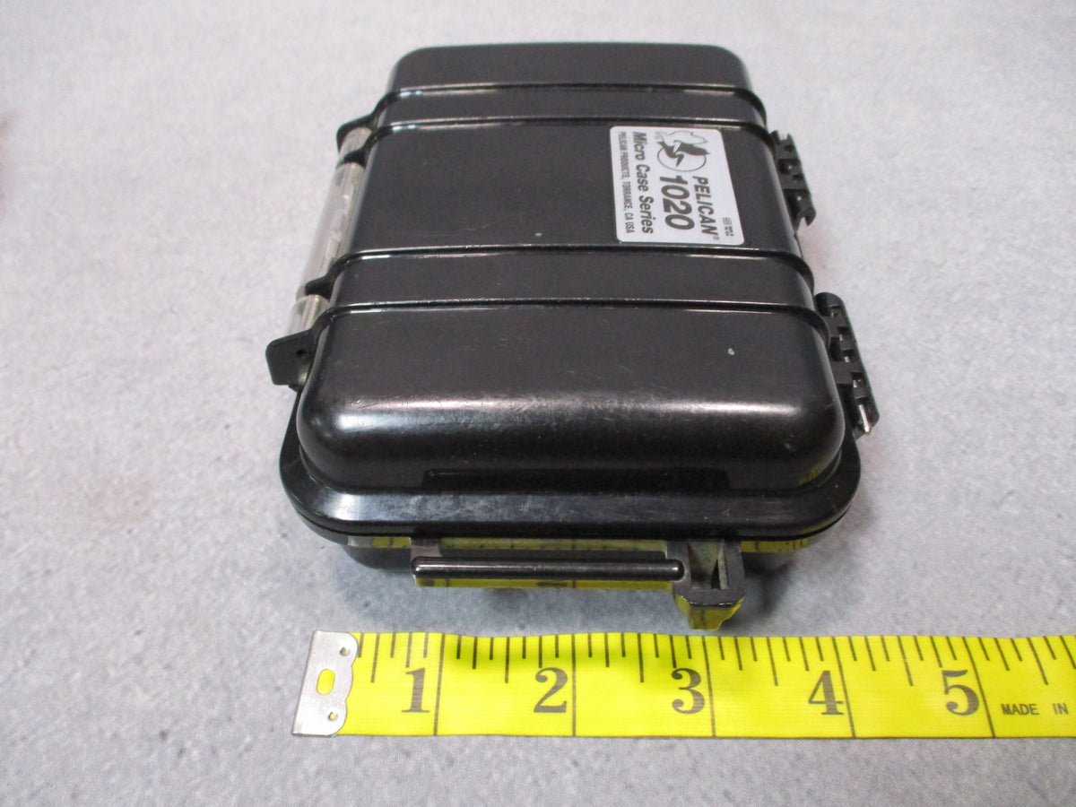 Pair of black Pelican 1020 Micro Cases, USA-made hard storage boxes shown side by sideેદ