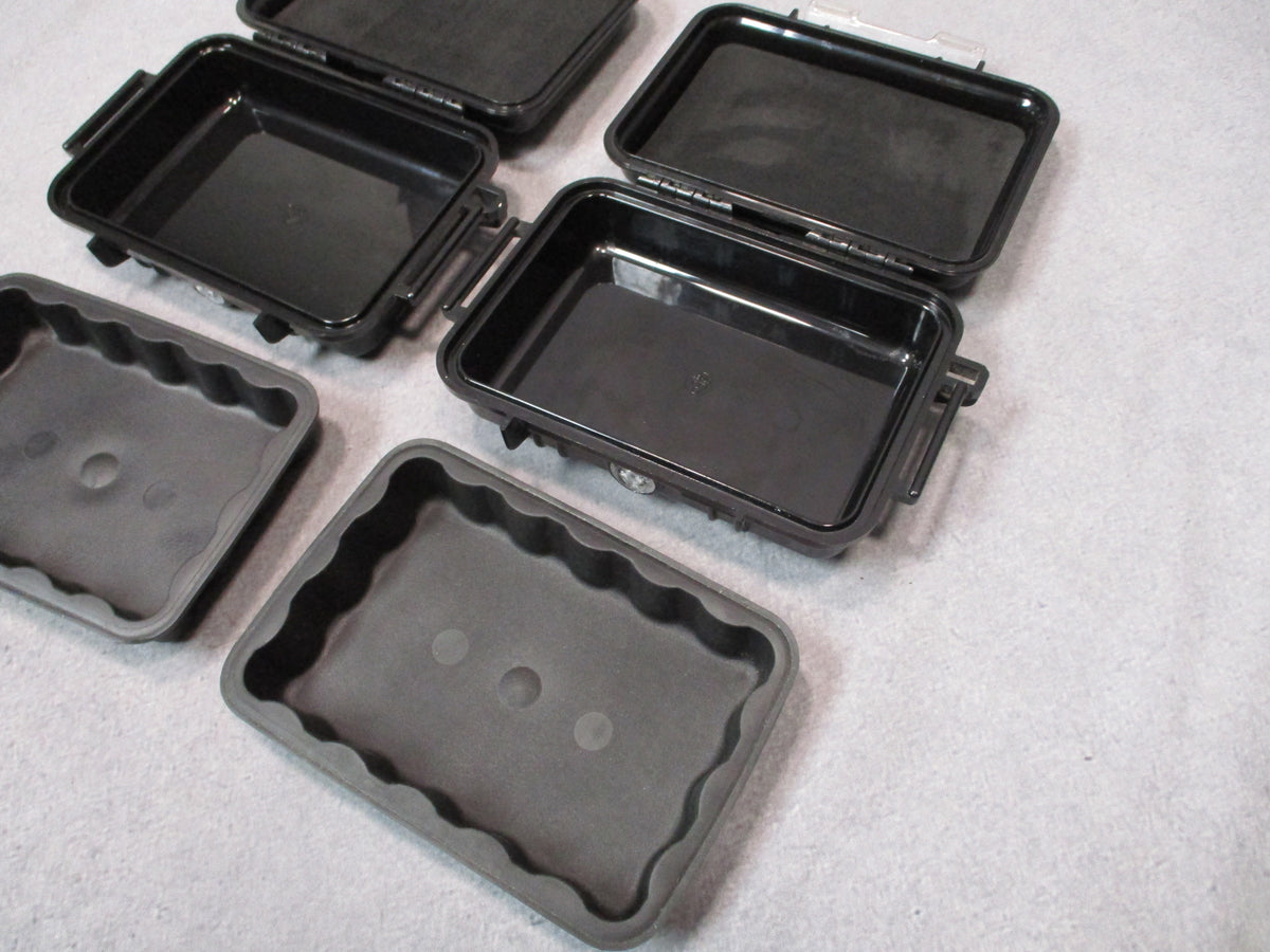 Pair of used black Pelican 1020 Micro Cases hard storage boxes, USA made, shown closed