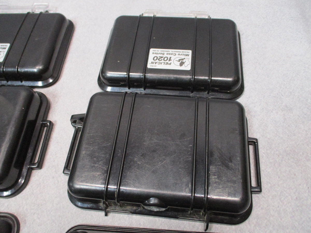 Pair of black Pelican 1020 Micro Cases, hard storage boxes, USA made, shown open and closed
